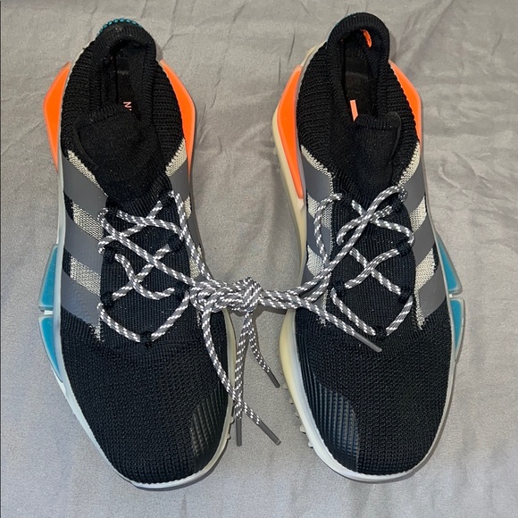 Adidas Black and Orange Sneakers with Unique Lacing System